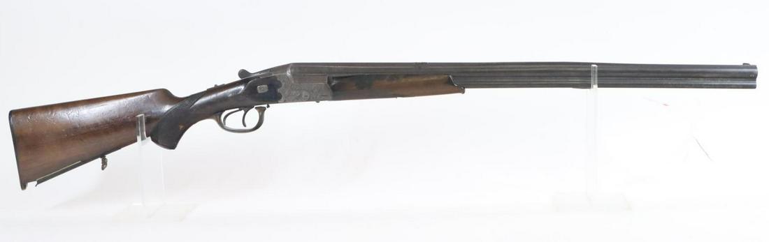 German Combination Guild Gun Over/Under: 9.3x74R? (8.85 bore) over 16Ga. 27 1/8" bbls, SN 1204. Dark gray patina, fair bores, solid rib has loose area near center, fold down safari style rear sight, 100% coverage engraved scalloped receiver 