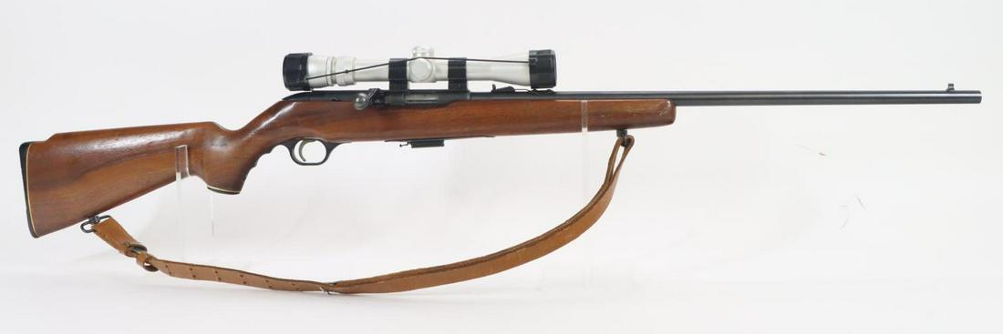 Mossberg Chuckster Model 640K Bolt Action Rifle: 22WMR, 24 1/4" bbl, NSN. 90% blue finish shows average handling, good bore, Simmons Pro Hunter 3-9x rifle scope with Duo-plex reticle and clear optics mounted on Weaver rings, wood stock shows moderat