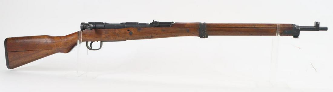Japanese Tokyo Type 99 Short Rifle Bolt Action Rifle: 7.7 Jap, 25 1/4" bbl, SN 19472. 80% blue finish shows general thinning with a light frost texture on receiver, good bore, ground mum, flip up rear ladder sight with good anti aircraft wings, missing c
