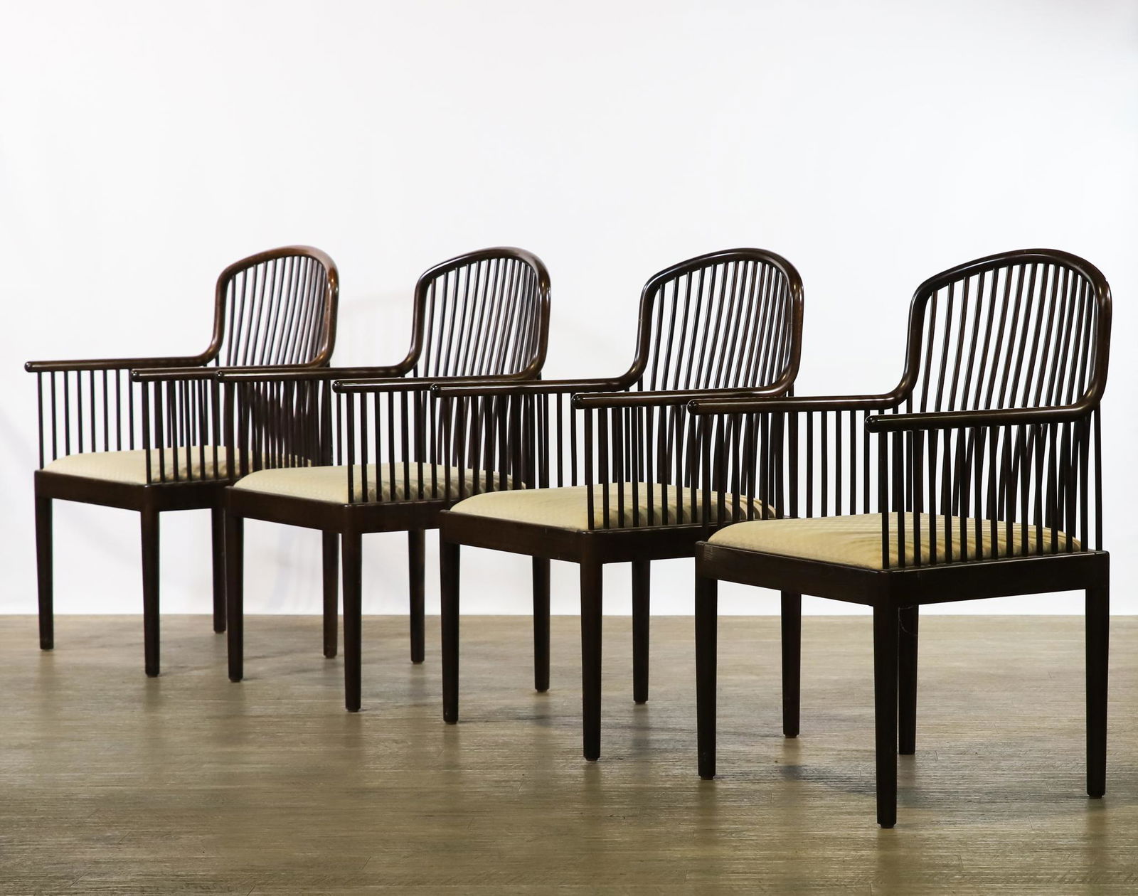 Davis Allen for Stendig "Andover" Chairs: Varnished rosewood spindle armchairs, set of (4), with tapered round legs and upholstered seats. Some scratches and other wear to the frames, and stains to the upholstery. 37"h x 21"w x 20"d, seat hei