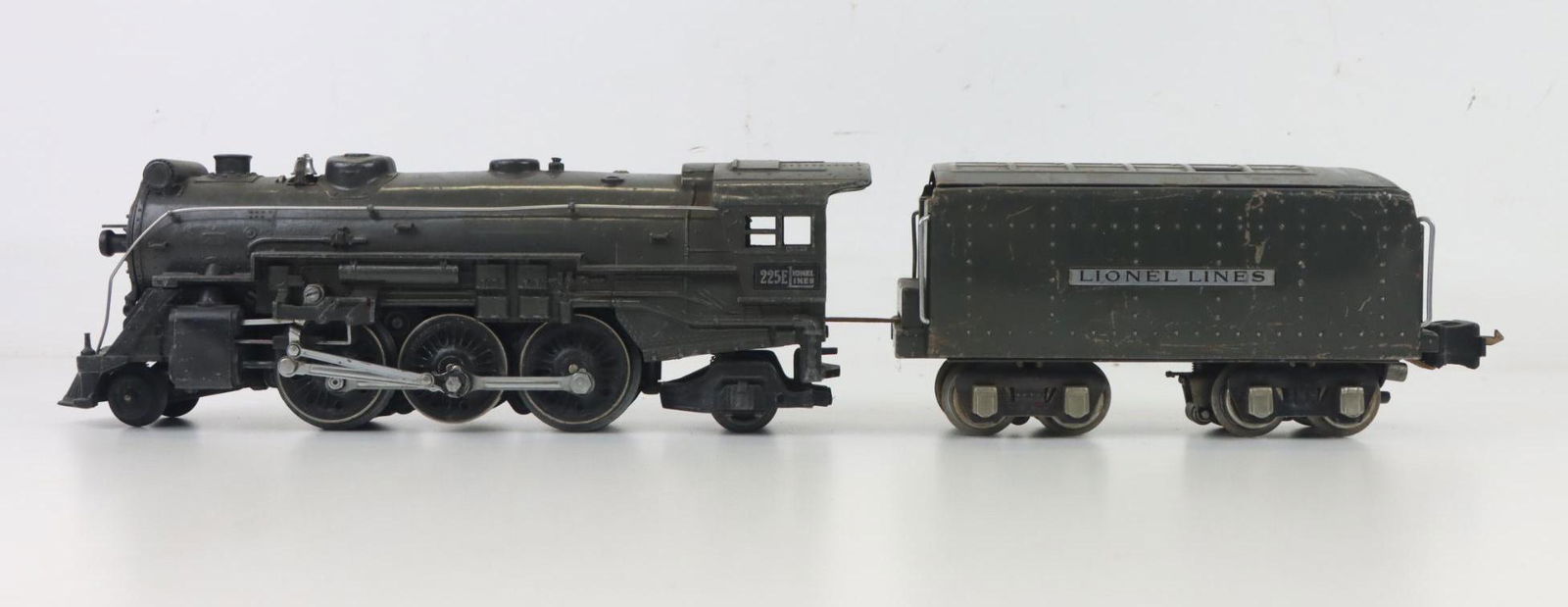 Lionel Steam Locomotive: O gauge, 3-rail, 2-4-2 #225E steam locomotive with tender.