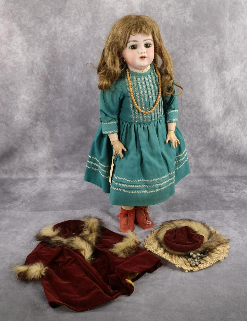 ANTIQUE GERMAN BISQUE DOLL(S).: LOT. "Mildred". 23" 12 S H 1039 DEP doll with stationary brown eyes, open mouth, pierced ears, brown human hair wig. Papier mache ball jointed body. Dressed in antique green wool dress with ivory silk