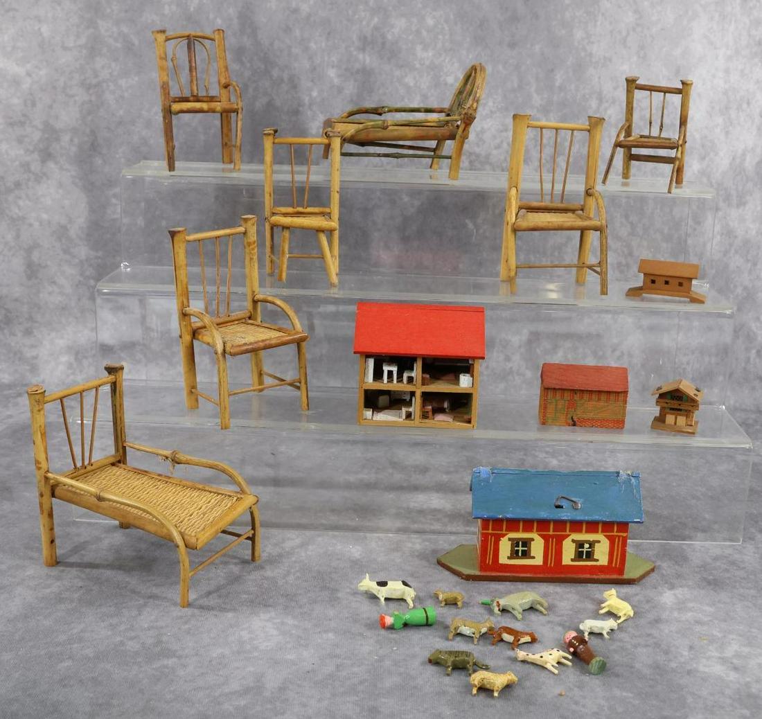MINIATURES/DOLLS.: FURNITURE/OTHER. Furniture - 7 Pc. set of antique bamboo/wicker. Chairs, chaises. Larger chaise is 4 1/2" T x 4 3/4" L. Other - German wooden buildings. Barn with animals is 2 3/4" T. Doll house is 3"