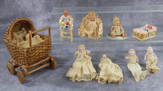 MINIATURES/DOLLS.: MINIATURES - DOLLS. Antique. Lot of baby dolls. German painted bisque, German plastic. Candy baby. German all bisque. Babies in carriage, high chair, bassinette. Condition: age discoloration on clothi