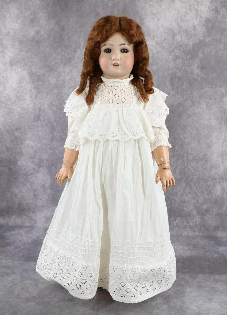 FRENCH BISQUE HEAD DOLL.: 26" 758 12 (Red Stamp) TETE JUMEAU Talking doll. Blue sleep eyes with fluffy lashes (glue on left lashes). Open mouth, pierced ears, Long curly auburn mohair wig. Papier mache jointed body marked (blu