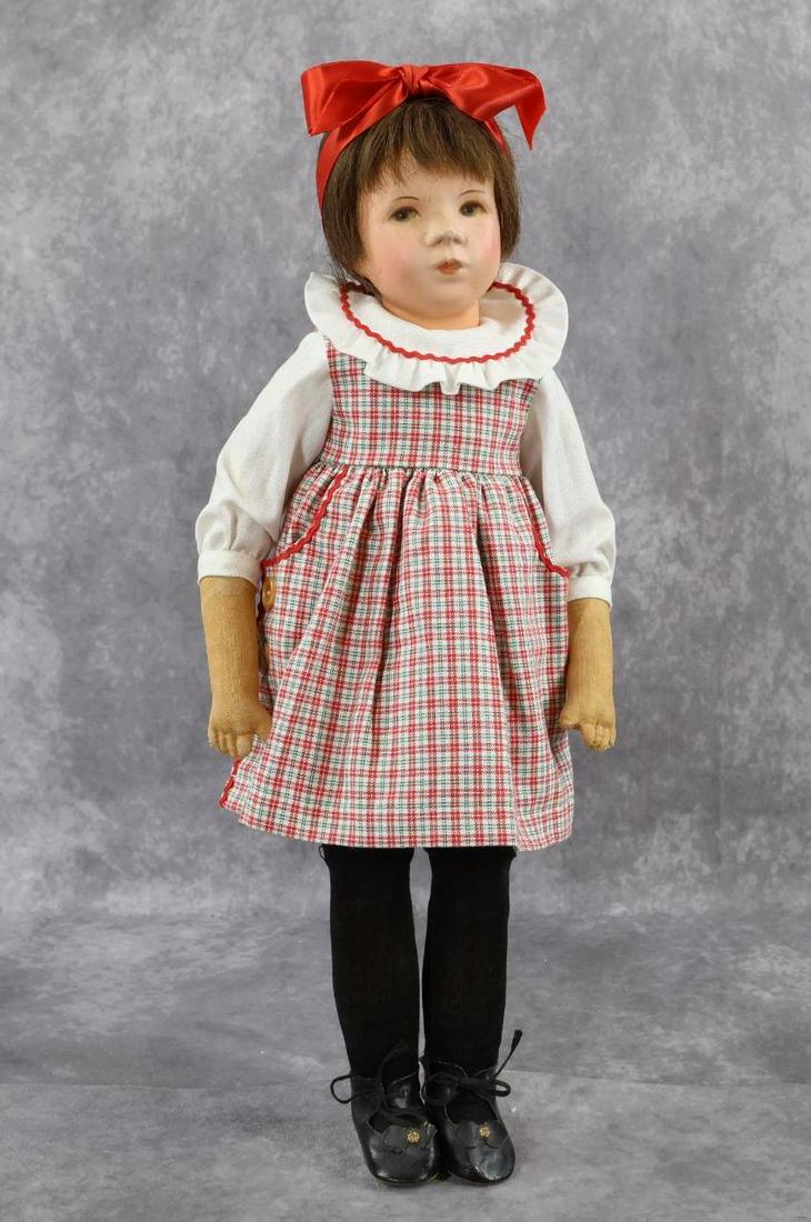 KATHE KRUSE.: 18" Girl doll. Stamped number on bottom of left foot only. Painted cloth head? with painted features, brown human hair wig. Swivel neck. Cloth body has thin disc jointed legs, separately stitched arms