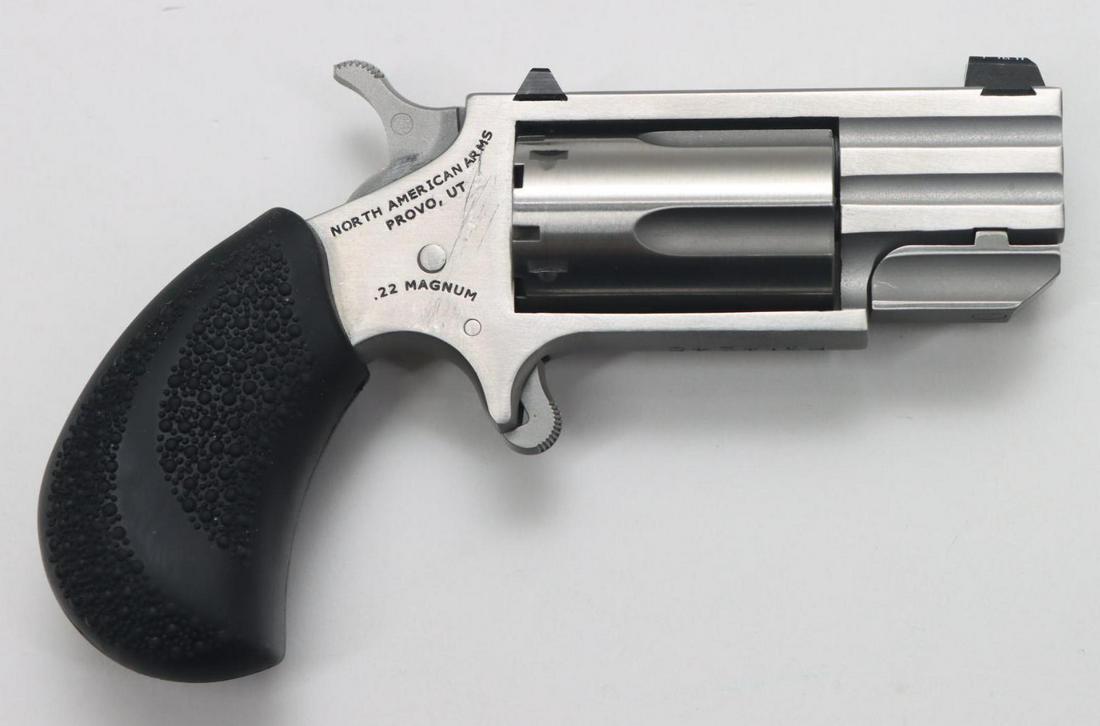 North American Arms Pug-T Single Action Revolver: 22WMR, 1" bbl, SN PG14245. Matte stainless finish, good bore, Trijicon Tritium front sight, slip on pebble textured rubber grips in factory plastic case. Very good condition. 23-0155