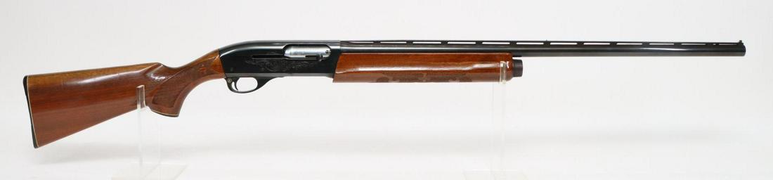 Remington 1100 Semi Combo Automatic Shotgun: 12Ga. 28 3/4" bbl, 2 3/4" chamber, Mod choke, SN L023064V. 98% blue finish shows thinning on crisp edges and a small 5?8" area of abrasion on top rear of receiver at base of non glare serrations, good