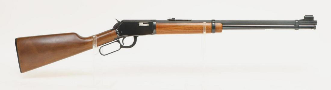 Winchester Model 9422 Lever Action Rifle: 22S,L,LR, 20" bbl, SN F171729. 98% blue finish shows scattered freckles on barrel, good bore, hooded front sight, wood stock and forearm show average handling. 13 3/4" LOP, 3 1/2 lb trigger pull. Good