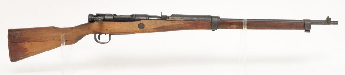 Kokura Type 99 Arisaka (Last Ditch) Short Rifle Bolt Action Rifle: 7.7 Jap, 25 1/2" bbl, SN 27441. 30% blue finish on receiver and a dark brown patina on barrel and furniture, fair bore, good mum, last ditch sights and bolt, wood stock shows moderate handling with la