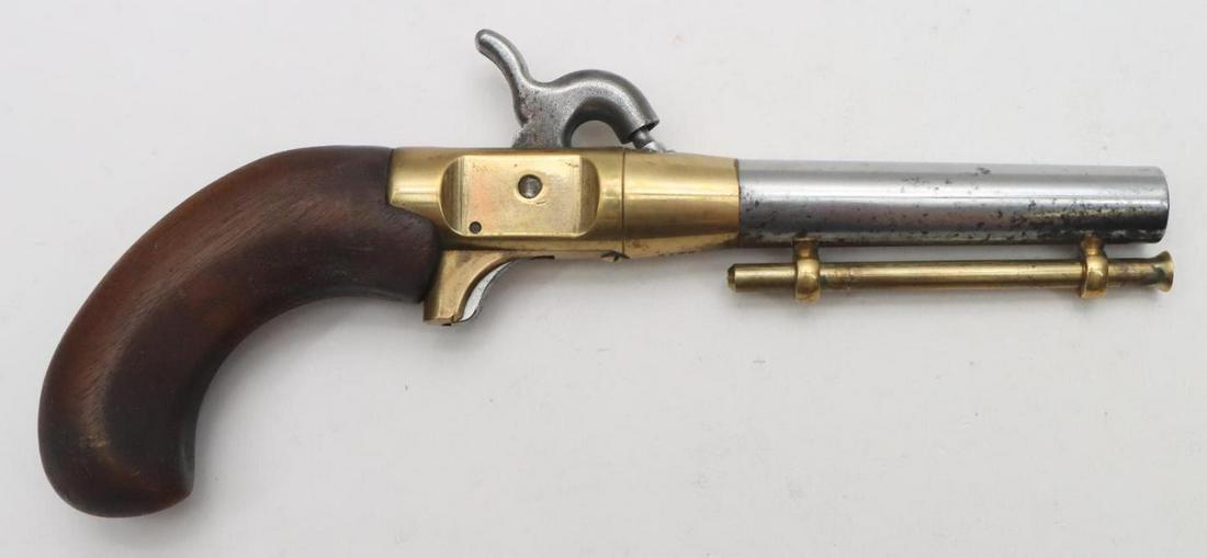 CMC? New Orleans Ace Percussion Pistol: .44, 3 1/2" bbl, SN 41657. 60% nickel finish on barrel shows areas of oxidation on bottom, fair bore, brass receiver with center hammer holds on full cock only, birds head wood grips show average hand