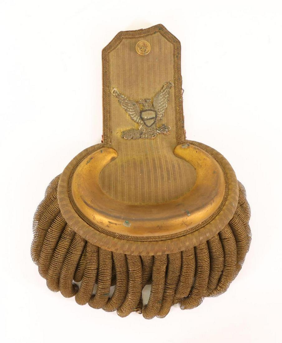 Civil War Period Colonel's Epaulette: Civil War period colonel's left epaulette. Presenting large silver bullion thread eagle. Epaulette presents 3" fringe and measures 8" x 6". Epaulette surface exhibits some tarnish and toning with fabr