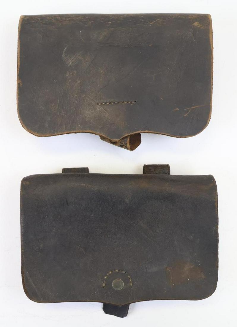 Pair of Civil War Cavalry Cartridge Boxes: Pair of Civil War cavalry cartridge boxes with one box being lightly marked at bottom of front flap "JOSEPH DAVY & CO./NEWARK NJ". Leather on both boxes exhibit some dryness. Provenance: Eugene T. Lom