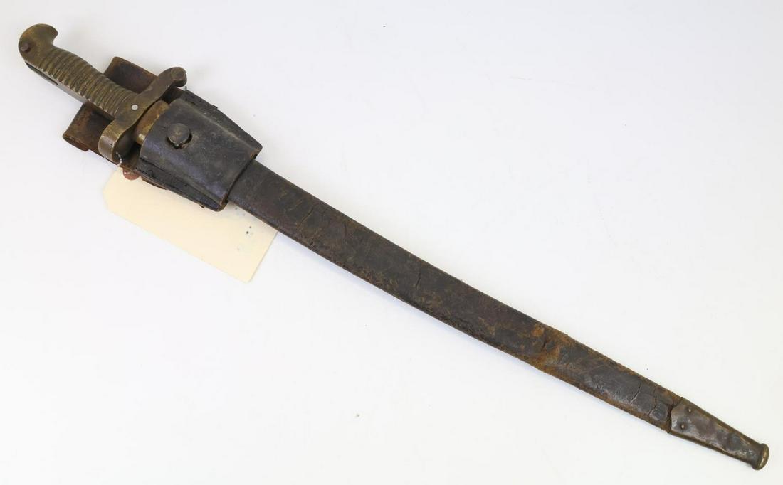 Civil War M1855 Saber Bayonet: Civil War M1855 saber bayonet measuring 24.5" (blade 19.5") and presenting brass hilt. Ricasso is unmarked. Bayonet presents brass crossguard. Bayonet housed in leather scabbard with brass throat and 
