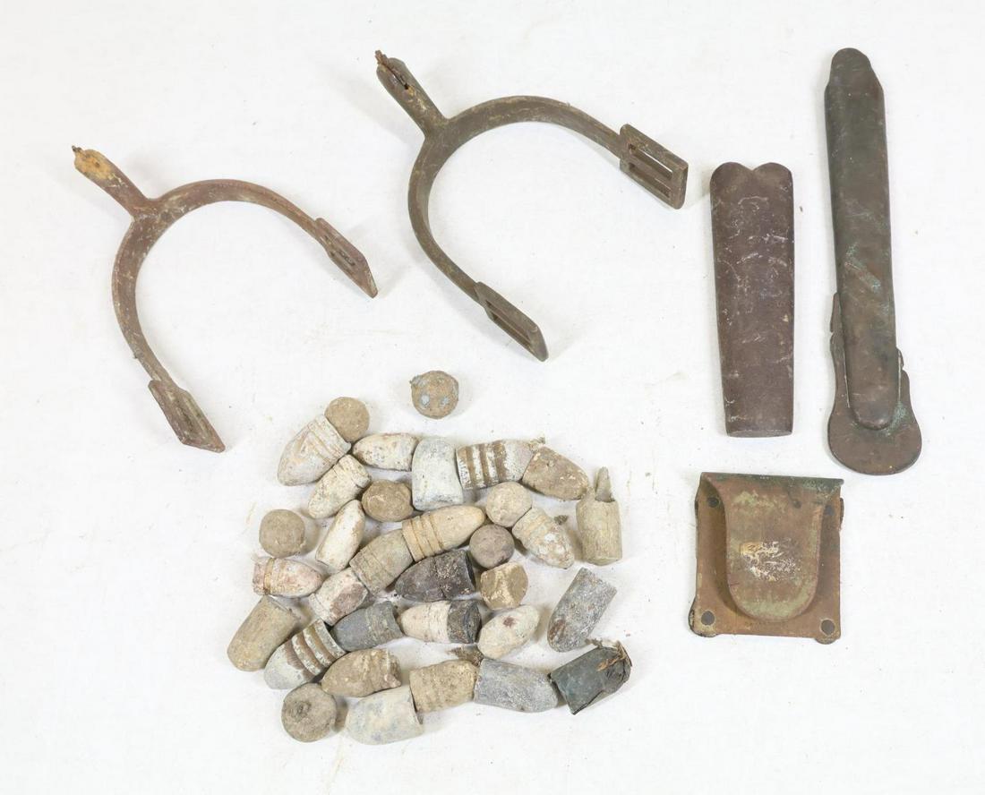 Civil War Dug/Excavated Relics: Civil War dug/excavated relics including: 1.) Pair of spurs. 2.) Thirty one bullets (mine), round ball, and others. 3.) One eagle button, 4.) One belt clip. 5.) One sword drag and one bayonet drag. Pr
