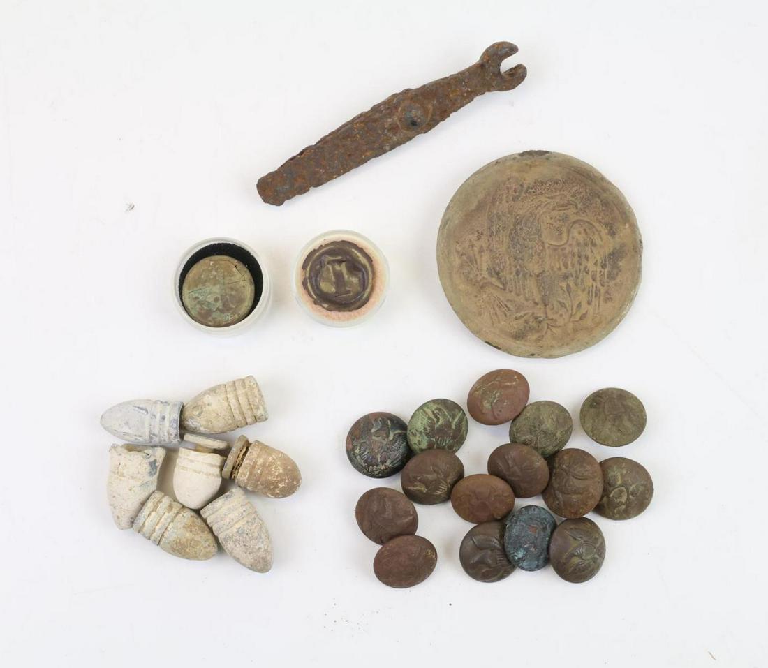 Collection of Excavated/Dug Civil War Relics: Collection of excavated/dug Civil War relics including: 1.) Dug Confederate old English "A" artillery button. Button exhibits corrosion and lack shank. 2.) Dug front portion (skin) of Confederate bloc