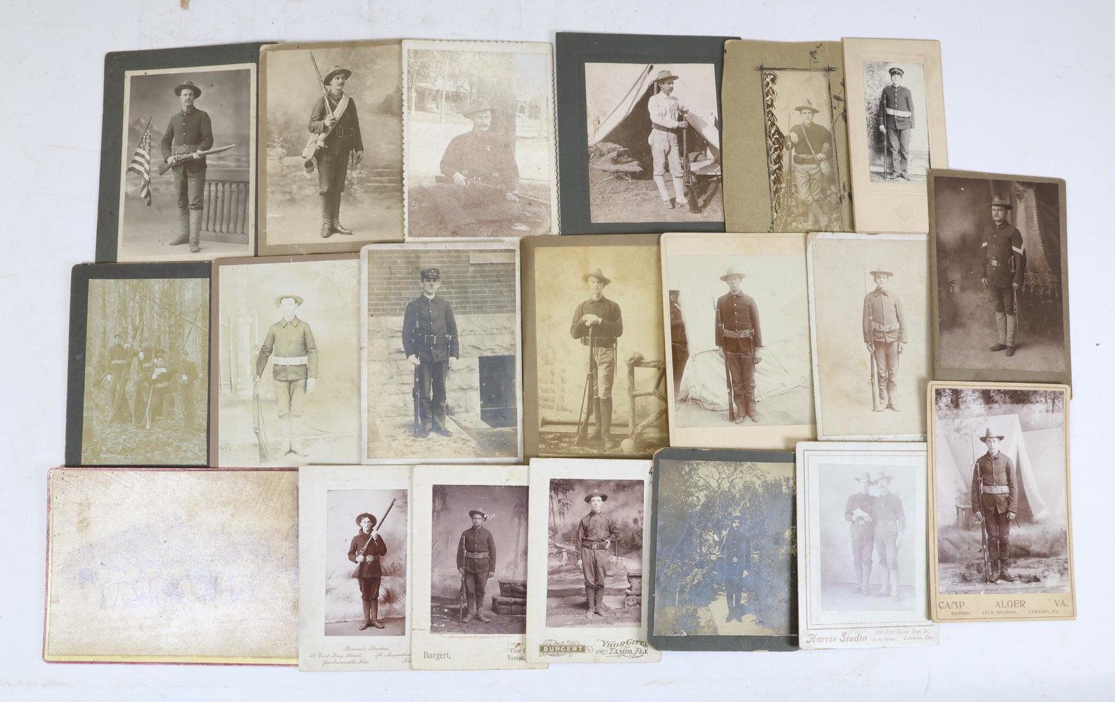 Collection of Spanish American War Cabinet Card Photographs: Collection of 20-Spanish American War period cabinet card photographs of various military personnel. Images include outdoor group shot, images with firearms, equipment, outdoor views in camp and other