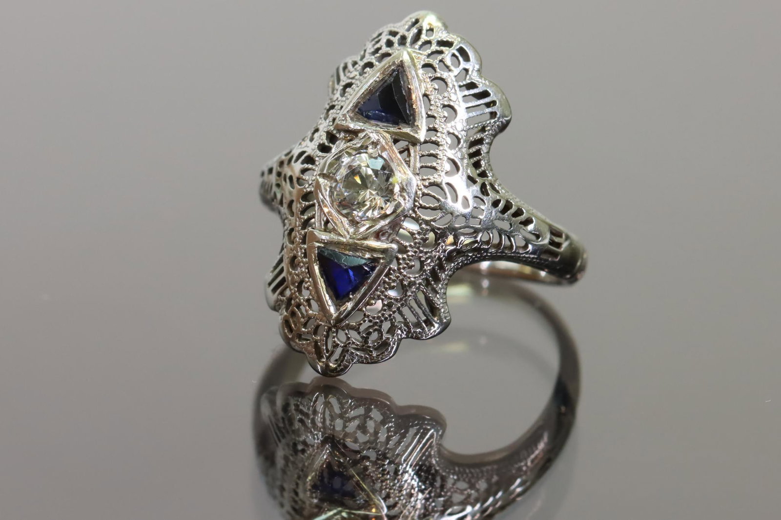 18k Sapphire and Spinel Art Deco RIng: 18k Sapphire and spinel art deco ring, 4 mm center stone, size 4, 1.7dwt 2.6gtw, â€‹â€‹â€‹â€‹â€‹â€‹â€‹**Please Note: In-house shipping is NOT available for the Colle