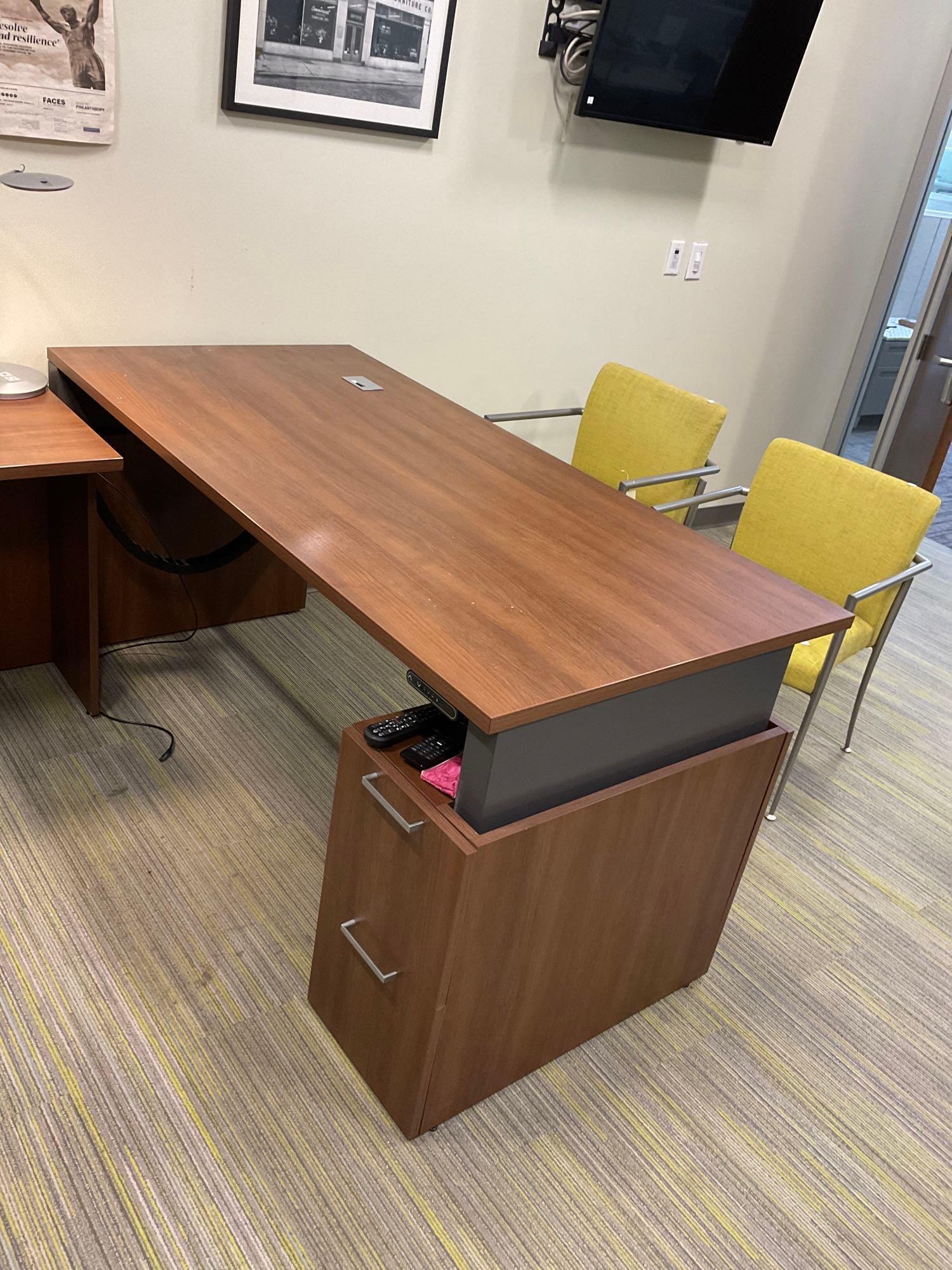 Adjustable Desk with File Cabinets: Electric programmable height adjustable desk with file drawers (2). Excludes contents, working. 70"w x 34"d. This lot is not eligible for Alderfer transport. Buyer is responsible for bringing all nece