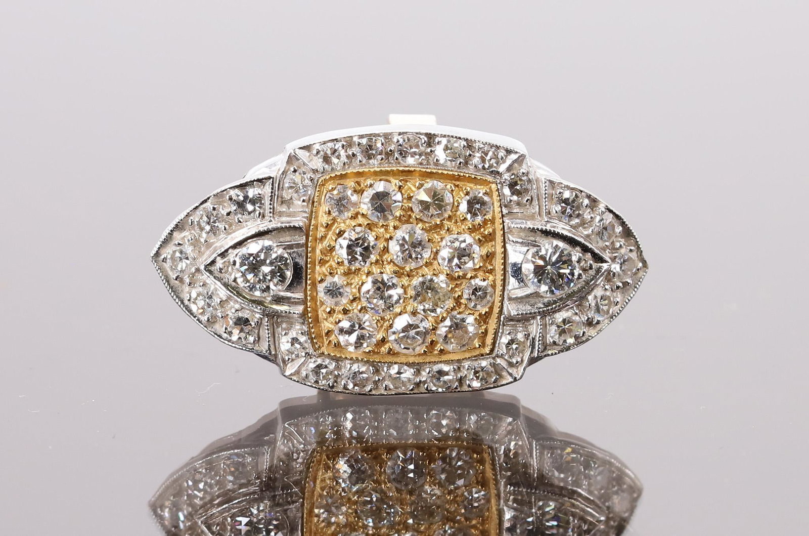 18k White and Yellow Gold Diamond Clip: 18k white and yellow gold center snap on clip for a "goose-neck" choker with 38 single cut diamonds, approx. total weight .85 carats and 2 full cut diamonds approx. .16 carat. 2.7dwt and 1"