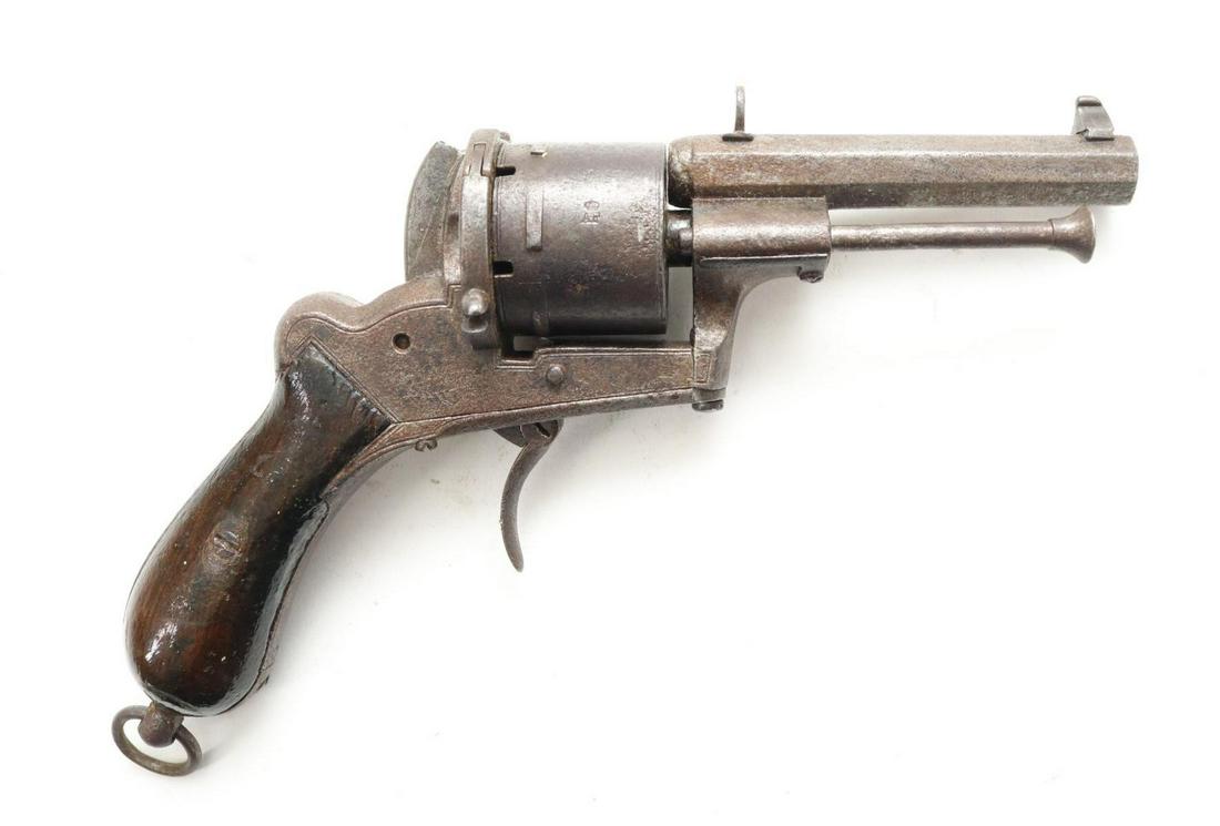 Antique Lefaucheux Pinfire Revolver: 9mm bore, 3 1/2" bbl, SN 105020. Gray/brown patina with moderate pitting, fair bore, hammer spur is broken off making it very hard to cock and does not hold on cock, cylinder does not advance, folding