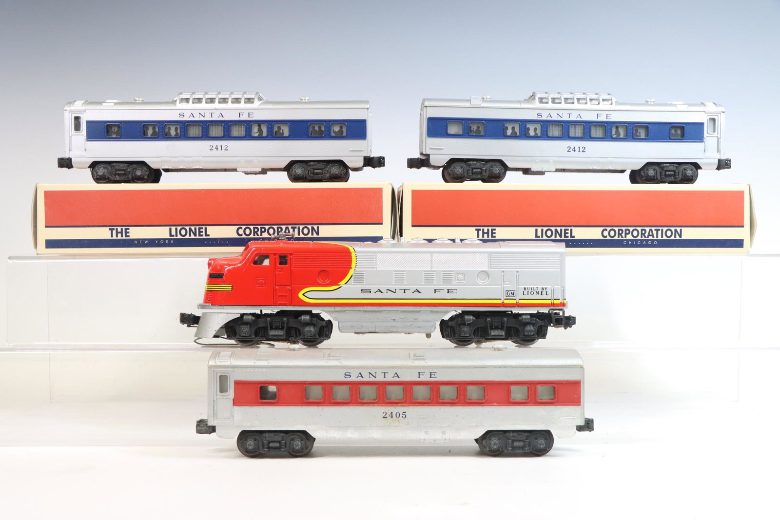 Lionel Diesel and Cars: O gauge 3-rail F3 Santa Fe diesel engine #2383, (2) passenger car #2412 and passenger car #2405.