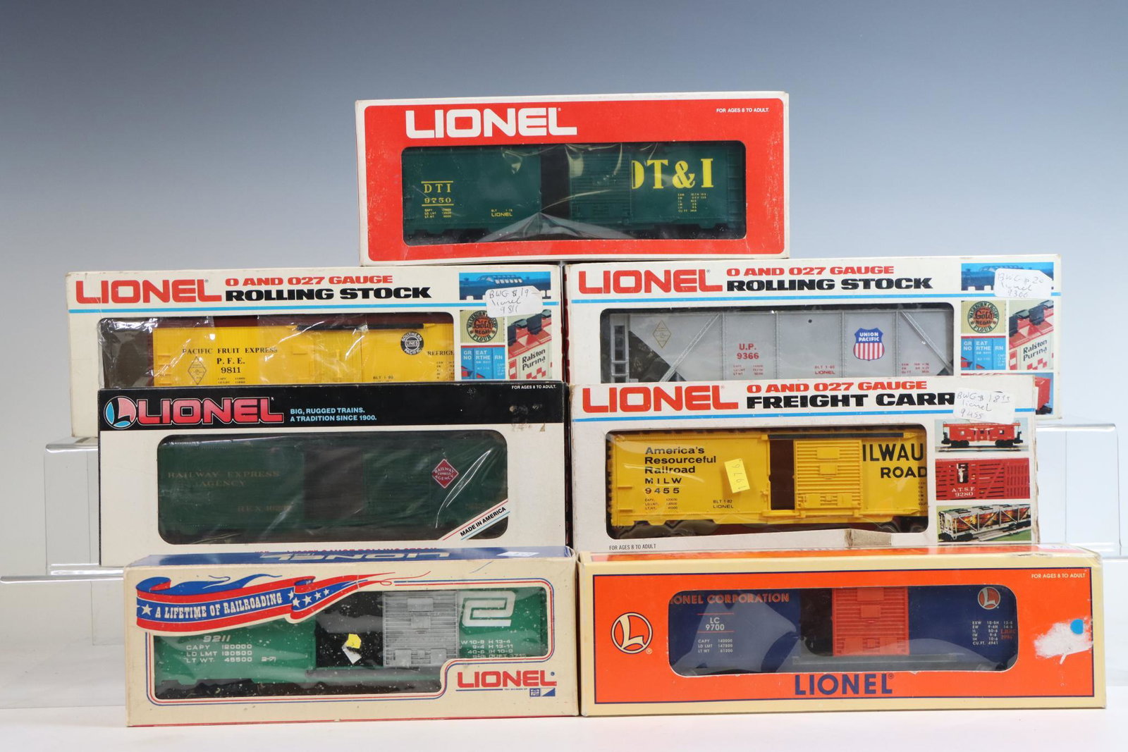 Lionel Train Cars: O gauge, 3-rail train cars including Pacific Fruit Express boxcar #9811, DT&I boxcar #9750, Lionel Corporation #9700, boxcar #9211, Milwaukee Road #9455, REA rolling stock and Union Pacific hopper #93