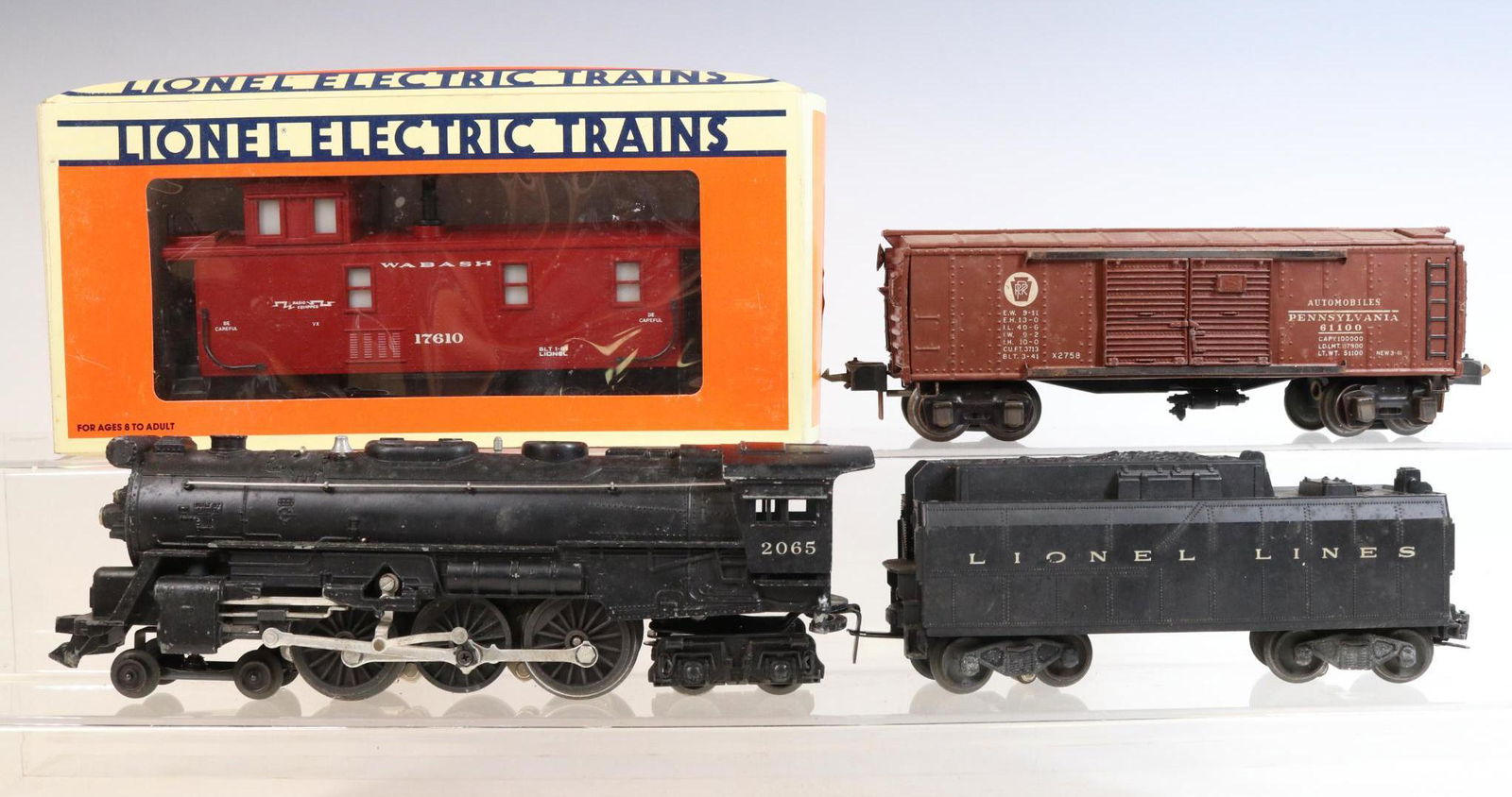 Lionel Steam Engine and Cars: O gauge, 3-rail, 4-6-4 steam locomotive #2065 with tender, PRR boxcar #2758 and Wabash caboose #17610.