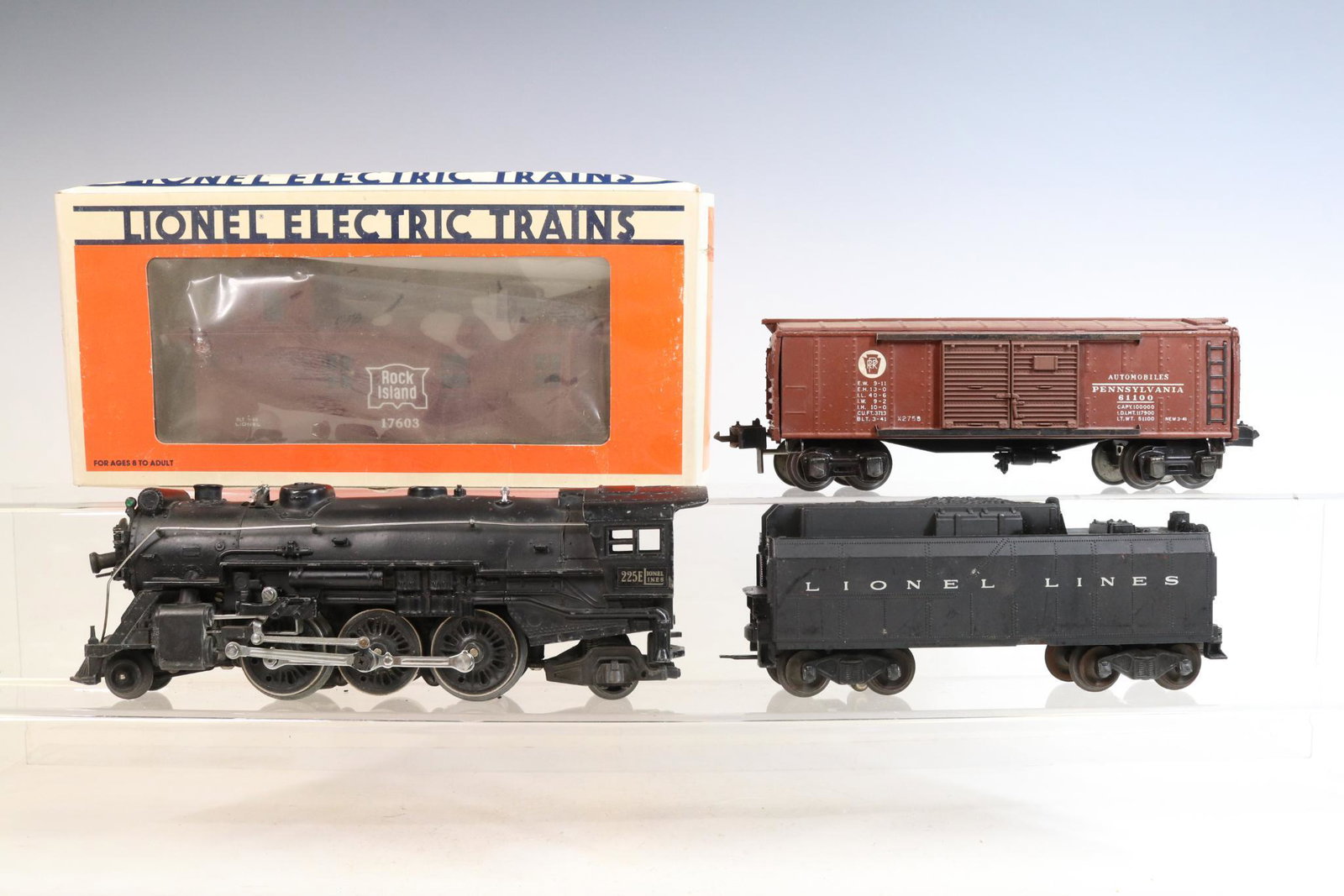 Steam Engine and Cars: O gauge, 3-rail, 2-6-2 steam locomotive #225E with tender, Rock Island caboose and PRR boxcar.