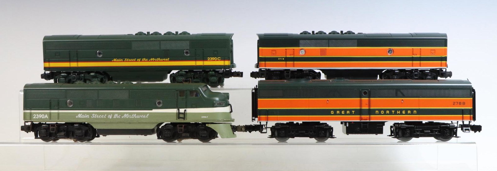 Lionel Diesel Engines: O gauge, 3-rail Great Northern B unit #371-B, Northern Pacific diesel A unit #2390A, Northern Pacific F3 B diesel #2390C and Great Northern FB diesel #278B.