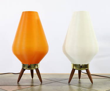 Yasha Heifetz for Rotaflex Lamps: Spun cellulose acetate shades in white and orange, on brass and walnut tripod bases. Unmarked. In working condition. 14.25"h x 7"w