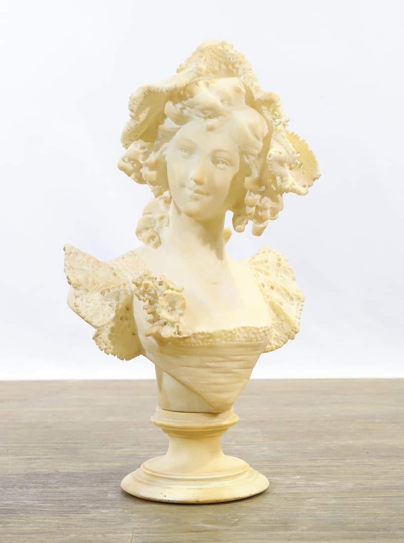 Adolfo Cipriani (1880 - 1930): Alabaster bust of a young lady, sculpture on a stand, signed to the neck en verso. There is a repair to the bonnet. 22"h x 13"w x 8.5"d