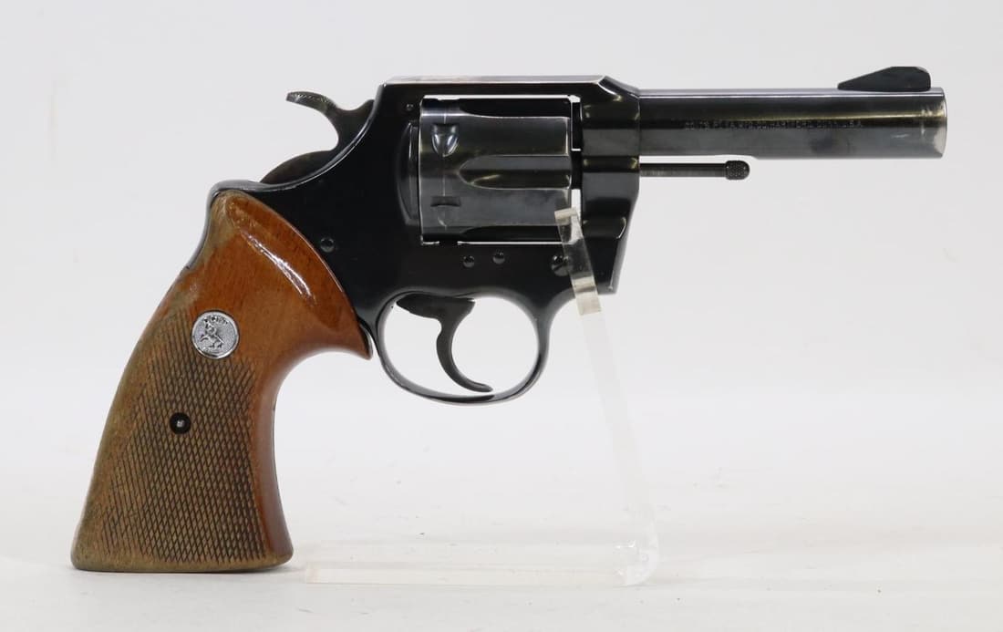 Colt Metropolitan MKIII Double Action Revolver: 38 Special, 4" bbl, SN J92318. 85% blue finish shows general thinning with loss on edges of muzzle and average cylinder drag line, good bore, checkered wood grips show moderate handling with finish lo