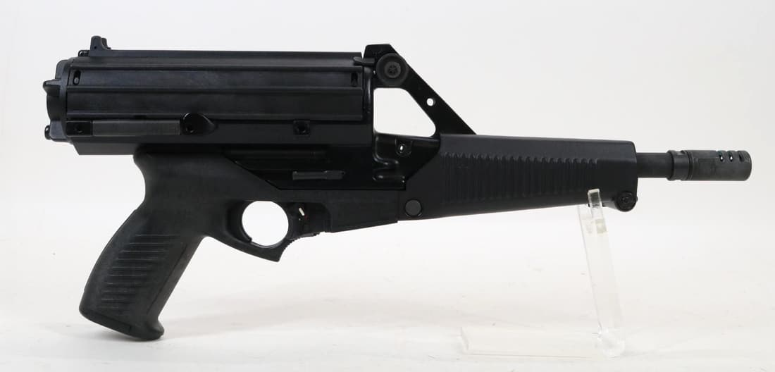 Calico Liberty III Semi Automatic Pistol: 9mm, 8 3/4" bbl, SN BOOO401. Matte black polymer shows no handling, good bore, threaded barrel with flash hider, left side sling loops,1-50 rnd rotary magazine. Excellent condition. 23-0950