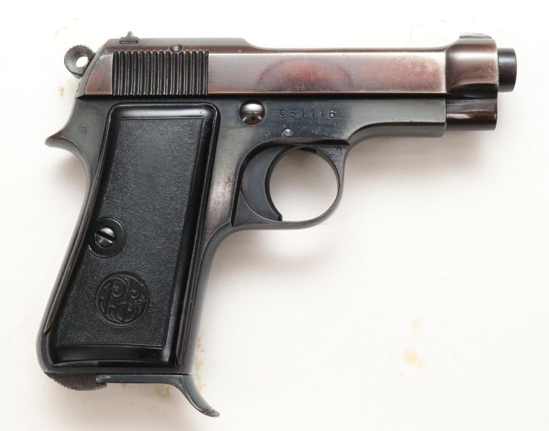 Italian Beretta M1934 Semi Automatic Pistol: 9mm Corto/380 Auto, 3 3/8" bbl, SN 931116. 98% blue finish on frame shows thinning on crisp edges, slide shows 90% plumb color with general thinning, good bore, left side rear corner of frame marked w