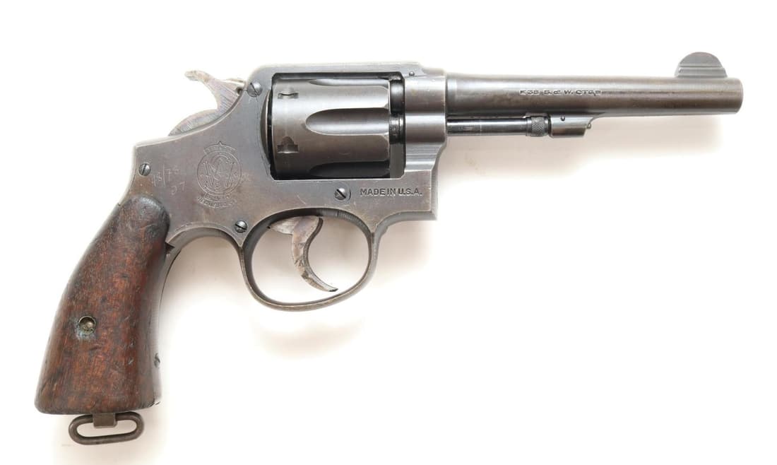 Smith & Wesson US Property M&P Victory 38 Double Action Revolver: 38 S&W, 5" bbl, SN V20402. Very thin gray parkerized finish shows loss on most edges, good bore, top strap marked UNITED STATES PROPERTY, side plate has small scratched 48/78 over 27 at top of grip, r