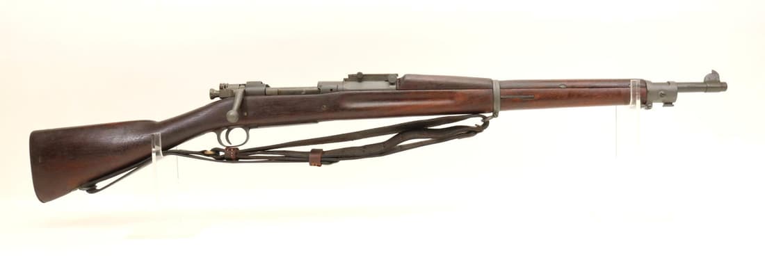 Springfield/CAI Model 1903 Bolt Action Rifle: 30-06, 24" bbl, SN 1332404. 99% gray parkerized finish shows only very light handling, fair bore, ME gauge reads 30, top of muzzle marked SA over flaming bomb over 9-29, right side of muzzle marked CA