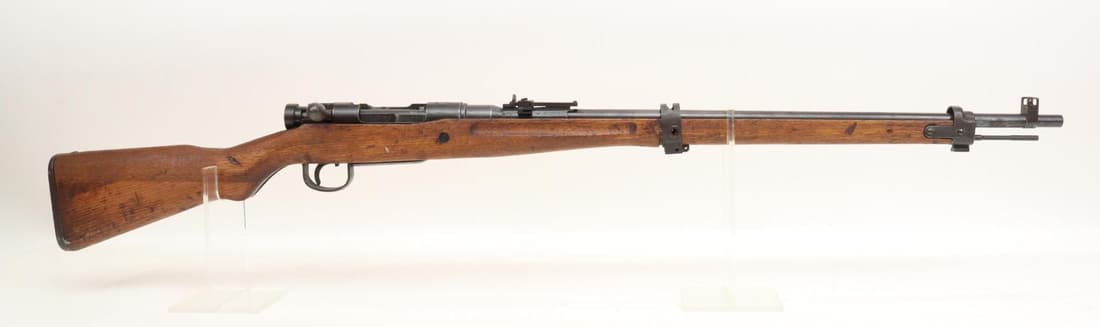 Japanese Tokyo Type 99 Arisaka Short Rifle Bolt Action Rifle: 7.7 Jap, 25 1/2" bbl, SN 40608. 80% blue finish shows general thinning with scattered light freckling, good bore, guarded front sight and flip up rear ladder sight missing anti aircraft wings, ground 