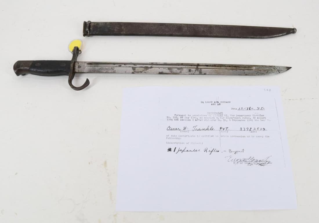 Japanese Type 30 Arisaka Bayonet And Scabbard: 15 5/8" blade with fullers in both sides, marked with 4 stacked balls, (Koishikawa Tokyo arsenal) on 1 side of ricasso, still cross guard with hooked Quillon and birds head pommel with push button rel