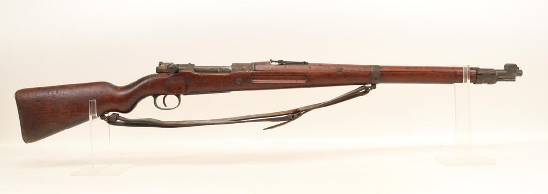 Polish P.F.K WASZAKA K98 Bolt Action Rifle: 7.92mm, 23 3/4" bbl, SN 38334. Dark gray patina, fair bore, receiver ring dated 1926 with eagle crest, non matching numbers, wood stock and handguards show moderate/heavy handling with large bruise on