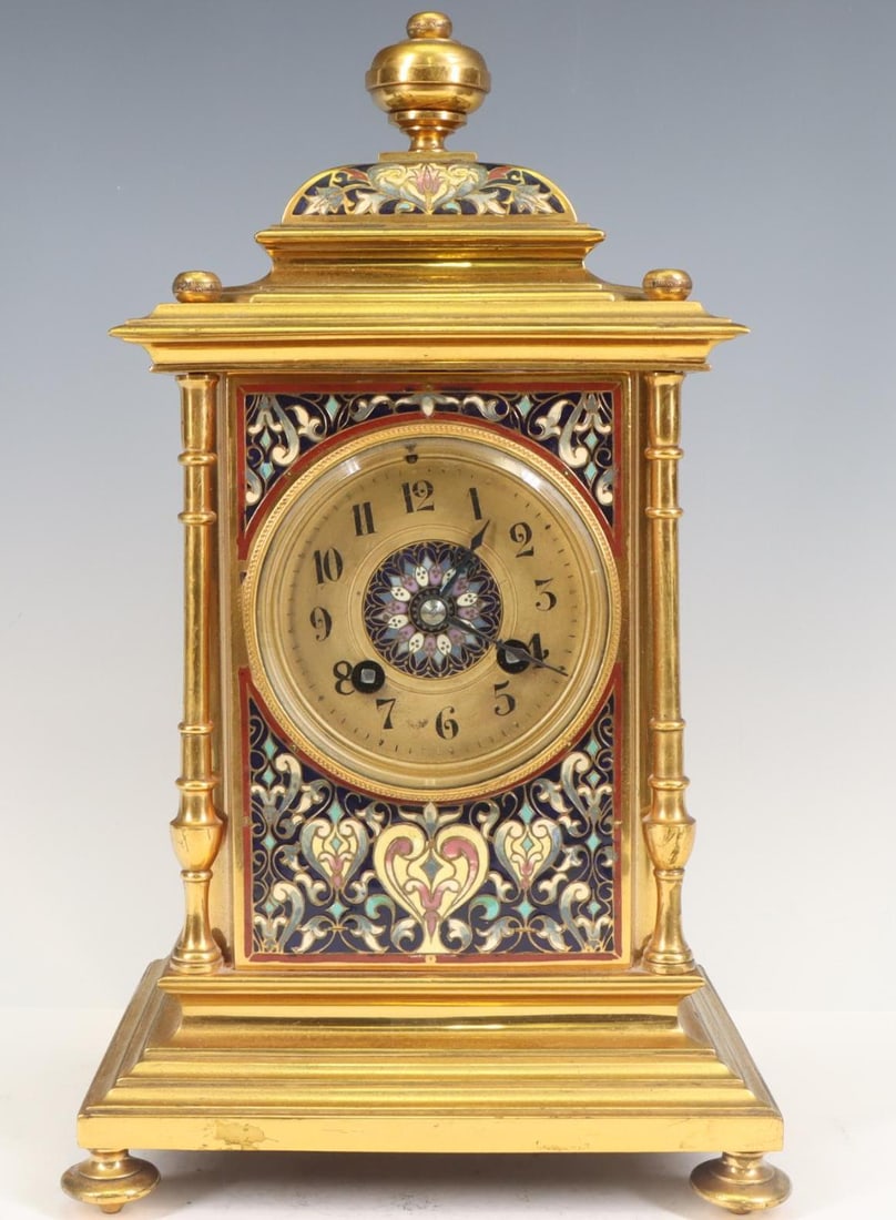 Japy Freres Champleve Mantel Clock: French champleve on brass mantel clock, 8-day, champleve medallion on center of clock face, clock face slightly off center. Missing the bell, pendulum, and key. 12.5”h x 7.25”w