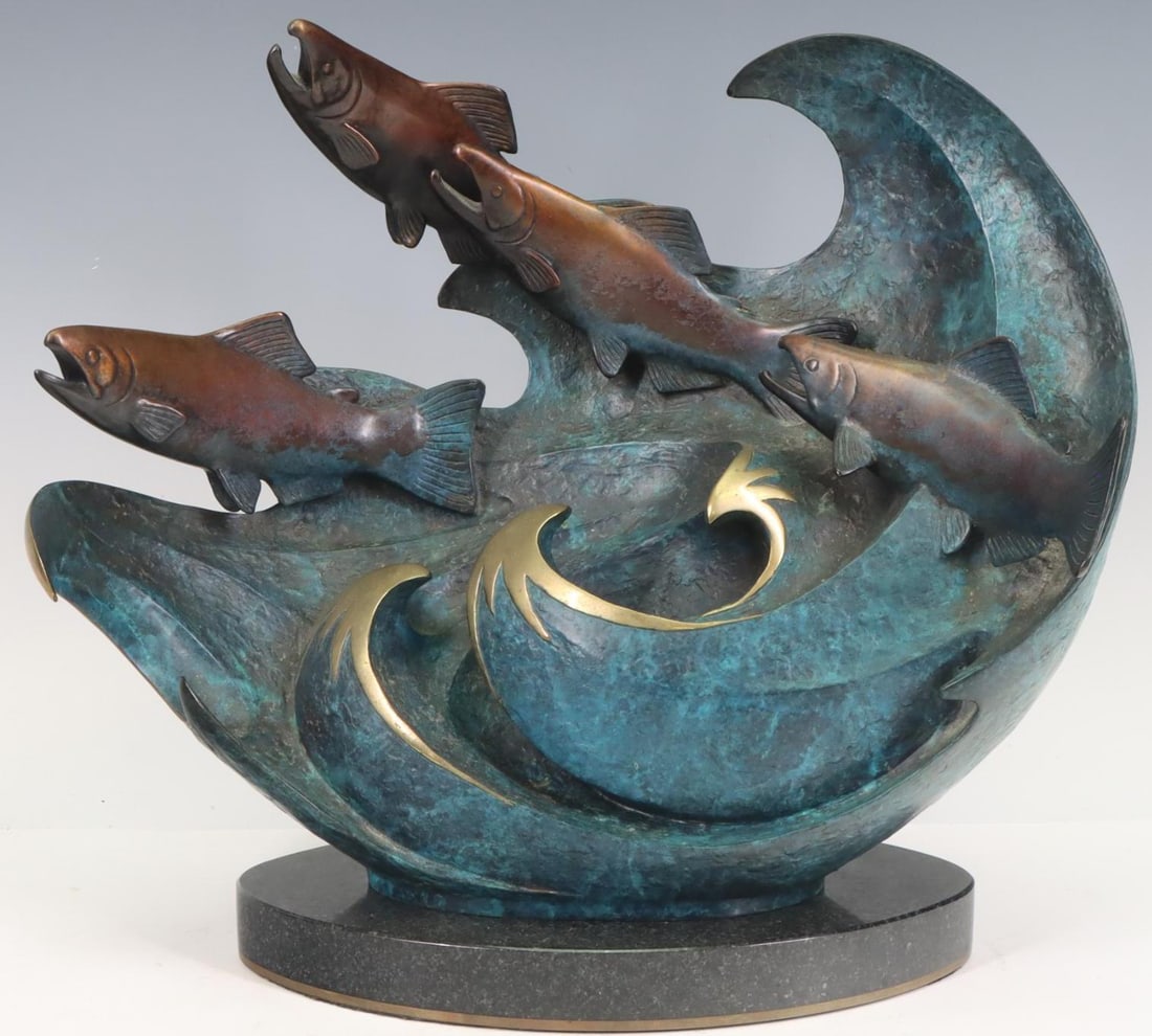 Jacques and Mary Regat (Contemp.): Collaborative bronze sculpture, fish jumping through a wave, impressed signature to the base, dated 1997, numbered 30 of 95, mounted to a marble stand. 11”h x 12”w