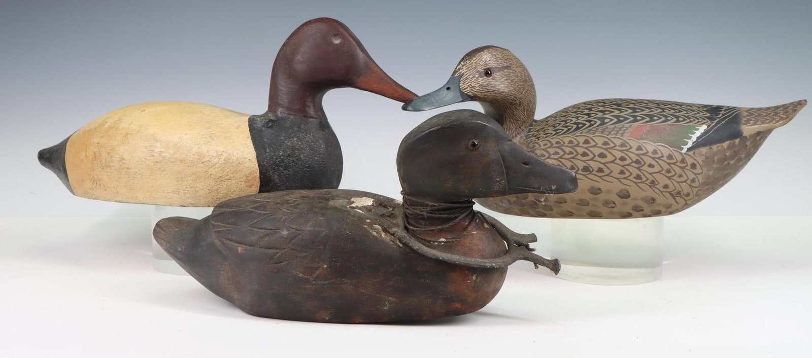 Antique Duck Decoys: Antique duck decoy, marked Sackee, #10, weighted, glass eyes, metal anchor, shows signs of wear from use. Duck decoy, pintail female, signed, dated 1968, wood, hand painted, glass eyes, minor scratche