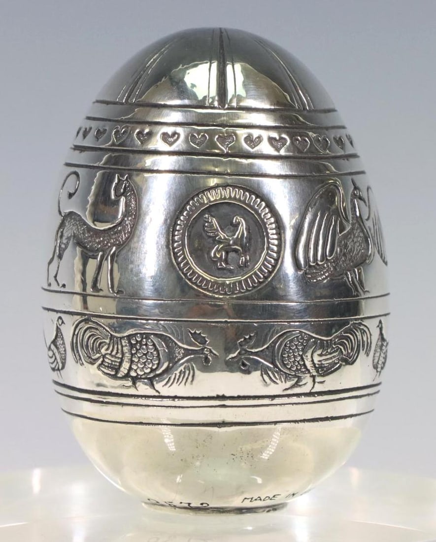 Greek Fine Silver Egg: Greek 999 silver egg with engraved birds, cat, hearts, and a medallion with a griffin. 3.25”h, 9.53 ozt