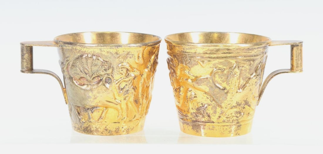 Ilias Lalaounis Vermeil Sterling Silver Cups: Greek repousse gold washed sterling silver cups, each depicting bulls and a man. 2"h, and 3.96 ozt