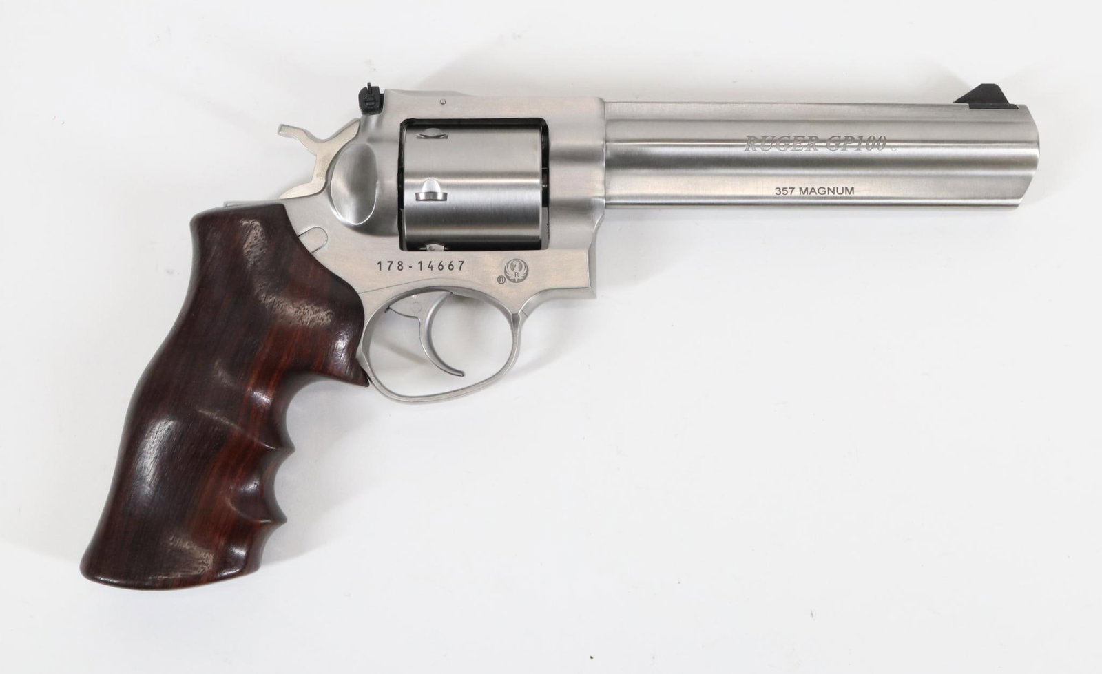 Ruger GP100 Double Action Revolver: 357 Mag, 6" bbl, SN 178-14667. Matte stainless finish shows only a very faint cylinder drag line, good bore, adjustable rear sight, solid rib with full underlug, wood finger groove combat style grips 