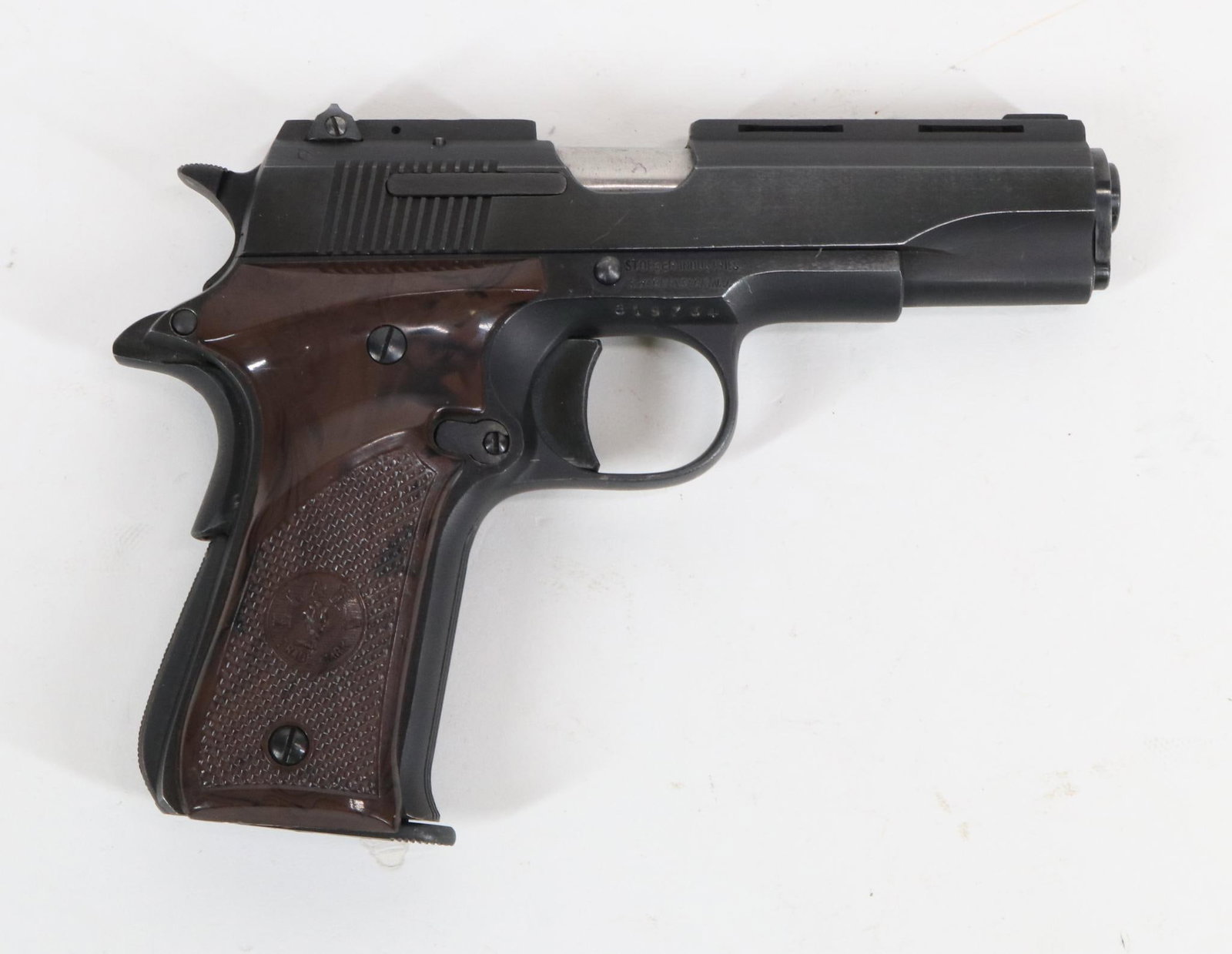 Gabilondo/Stoeger Llama Model III-A Semi Automatic Pistol: 380 Auto, 3 3/4" bbl, SN 619734. 99% blue finish shows only very light handling, good bore, vent rib, checkered plastic grips show no handling, 1-7 rnd magazine, homemade leather and snakeskin holster