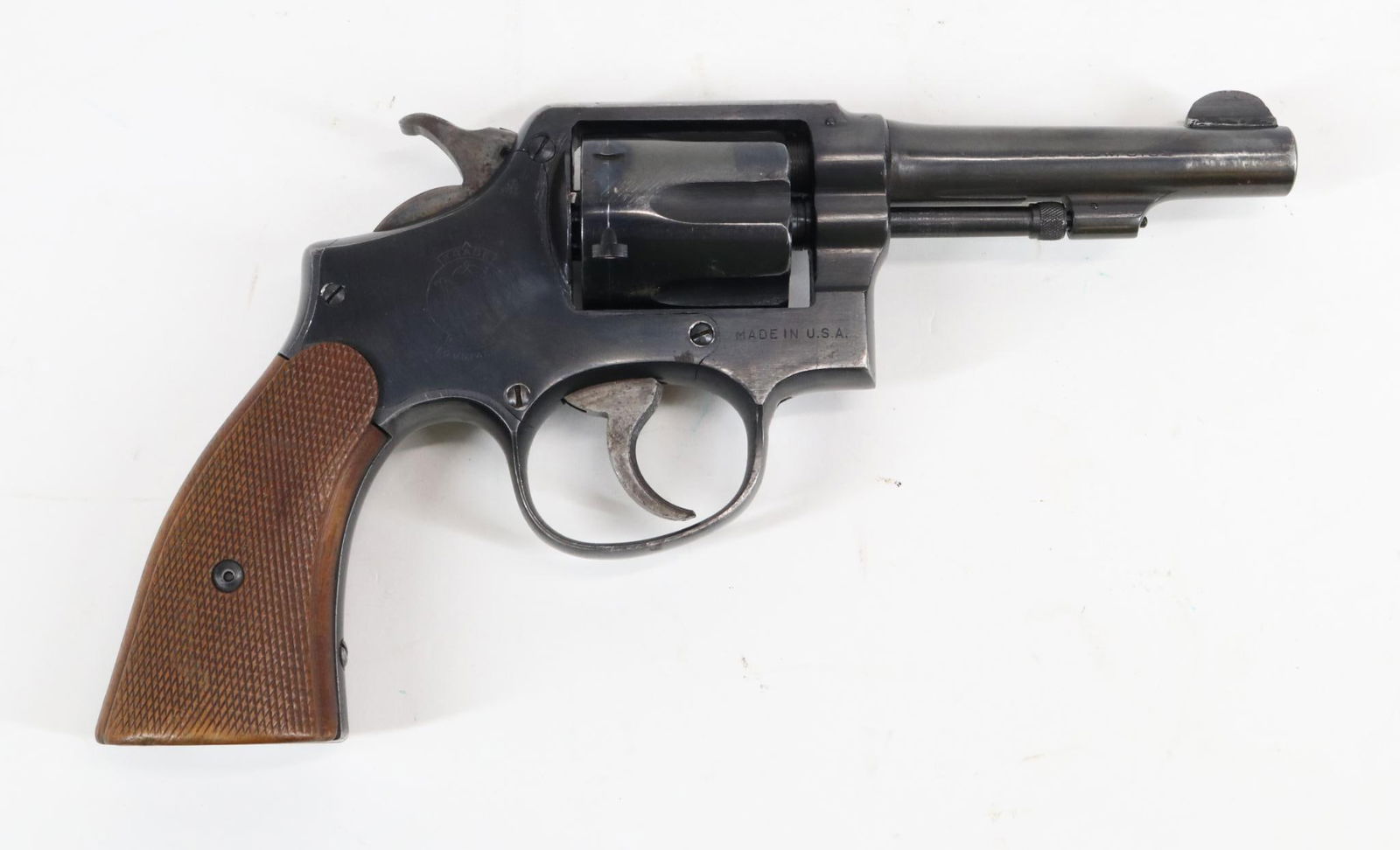 Smith & Wesson M&P Victory Double Action Revolver: 38 S&W, 4" bbl, SN V561885. 90% blue finish shows general thinning with areas of loss on crisp edges and average cylinder drag line, good bore, older replacement checkered wood grips show average hand