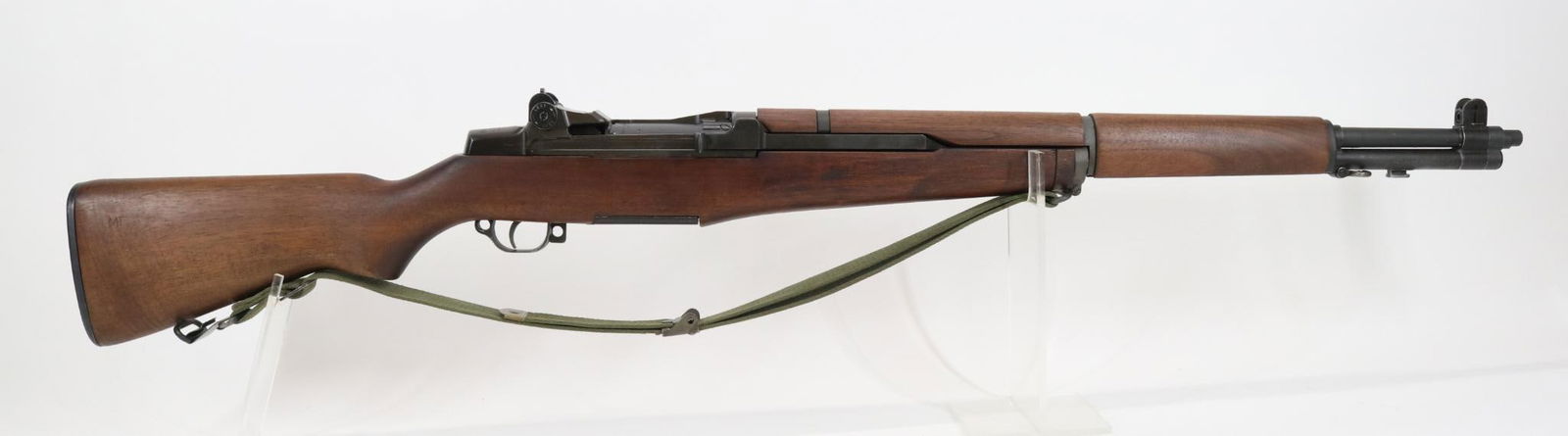Springfield M1 Garand Semi Automatic Rifle: 30-06, 24" bbl, SN 1465259. 98% gray/green parkerized finish shows light average handling, good bore, ME gauge reads .3005, right side of breech marked SA 10 64 Y61 P M, wood stock shows light handlin