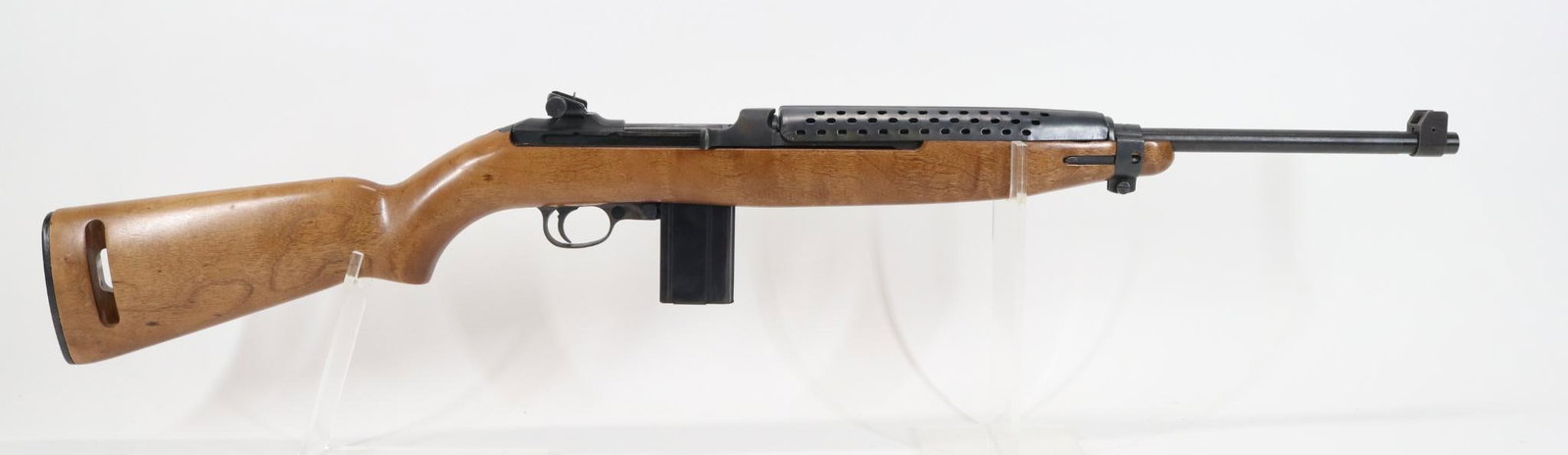 National Ordnance Inc M1 Carbine Semi Automatic Rifle: 30 Carbine, 18" bbl, SN 41880. 95% blue finish shows small area of loss on underside of barrel at front of forearm and a couple small areas of oxidation, good bore, ventilated metal handguard, wood st